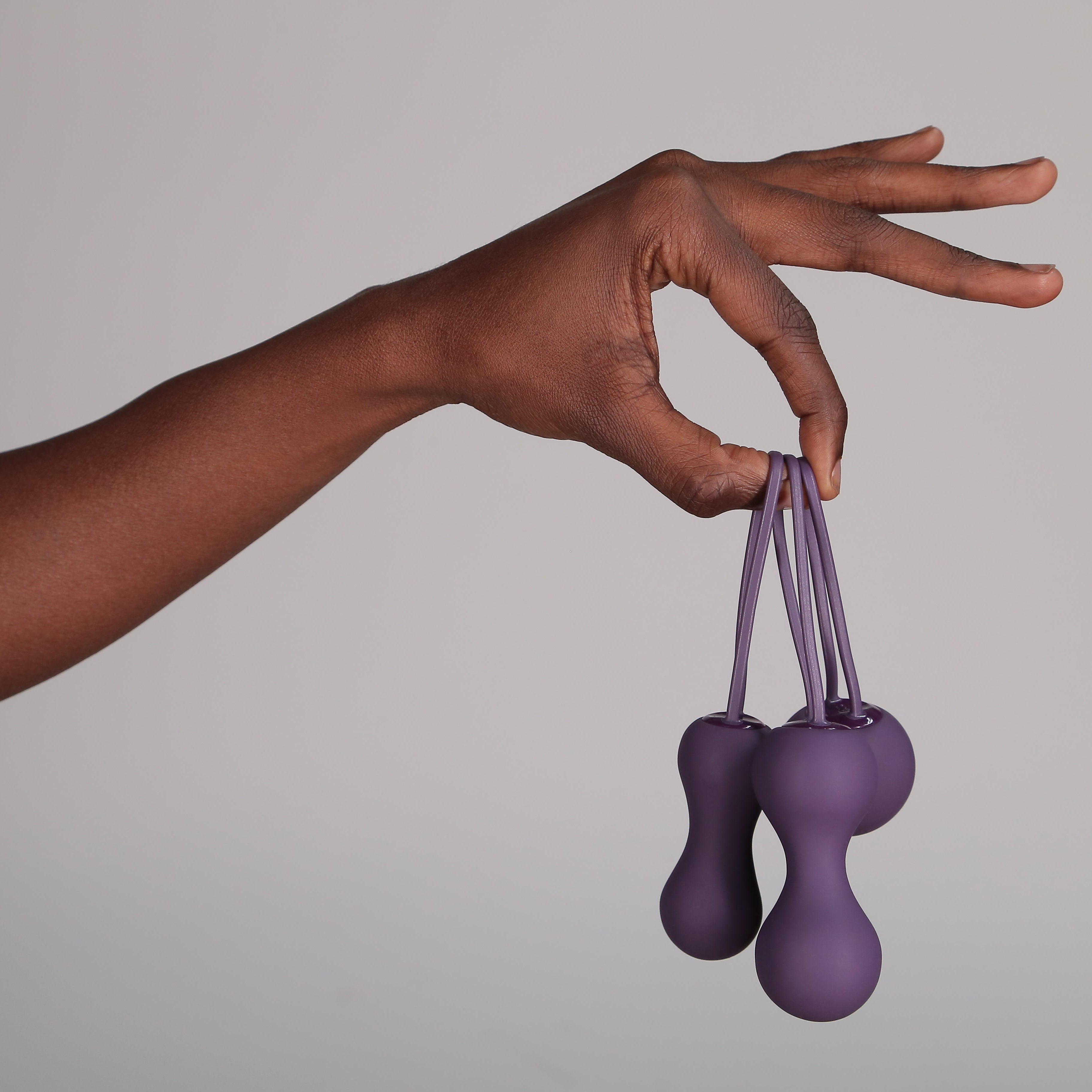 Hand holding 3 Step Kegel set