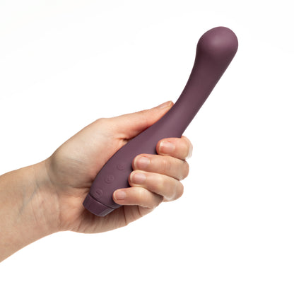 Hand holding purple Juno Vibrator 