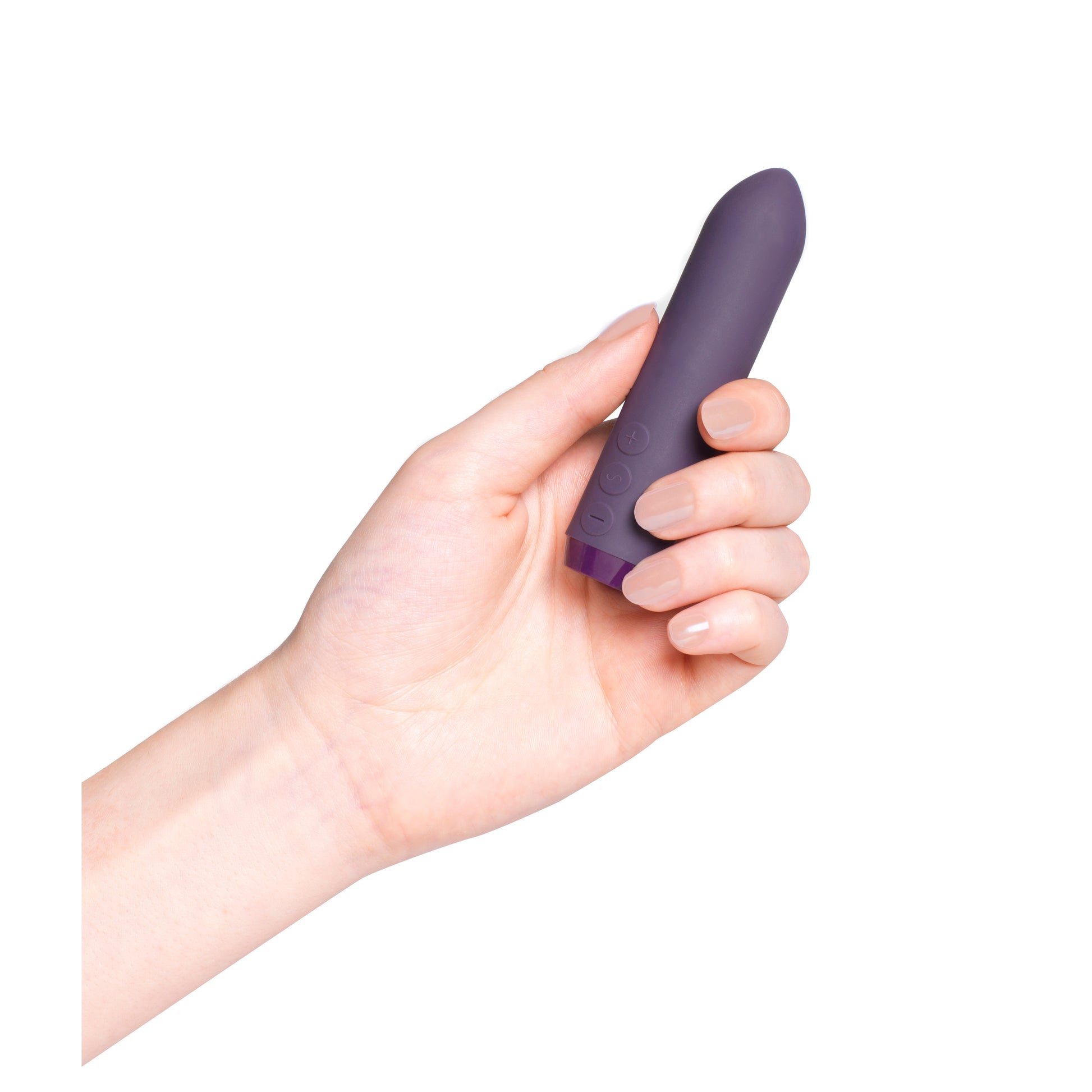 Hand holding purple classic bullet vibrator on white background
