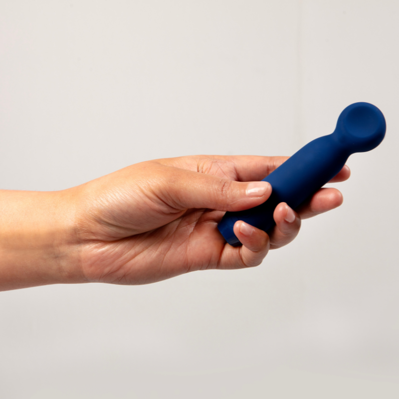 Hand holding Vita Vibrator in hand