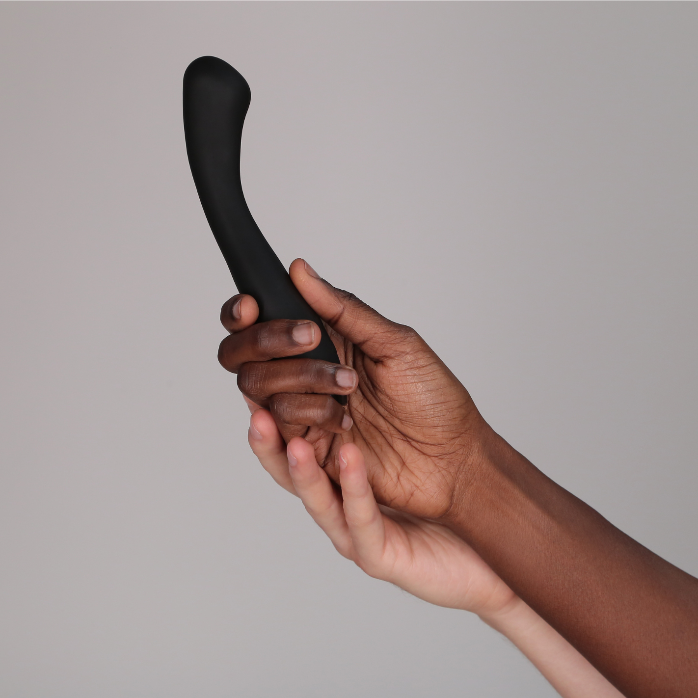 Hands holding Juno Flex vibrator in black 