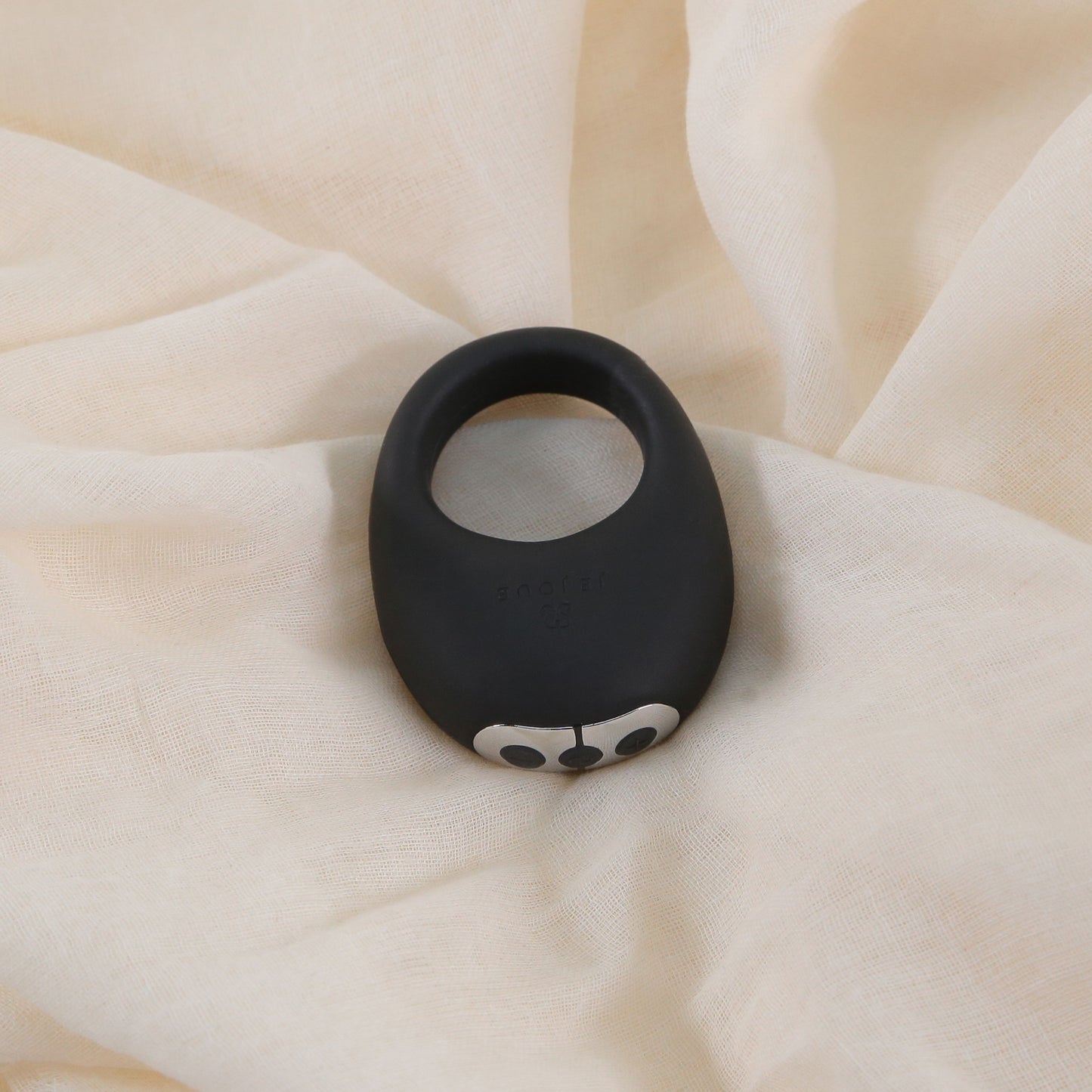 Mio Vibrating Cock Ring on bed sheet