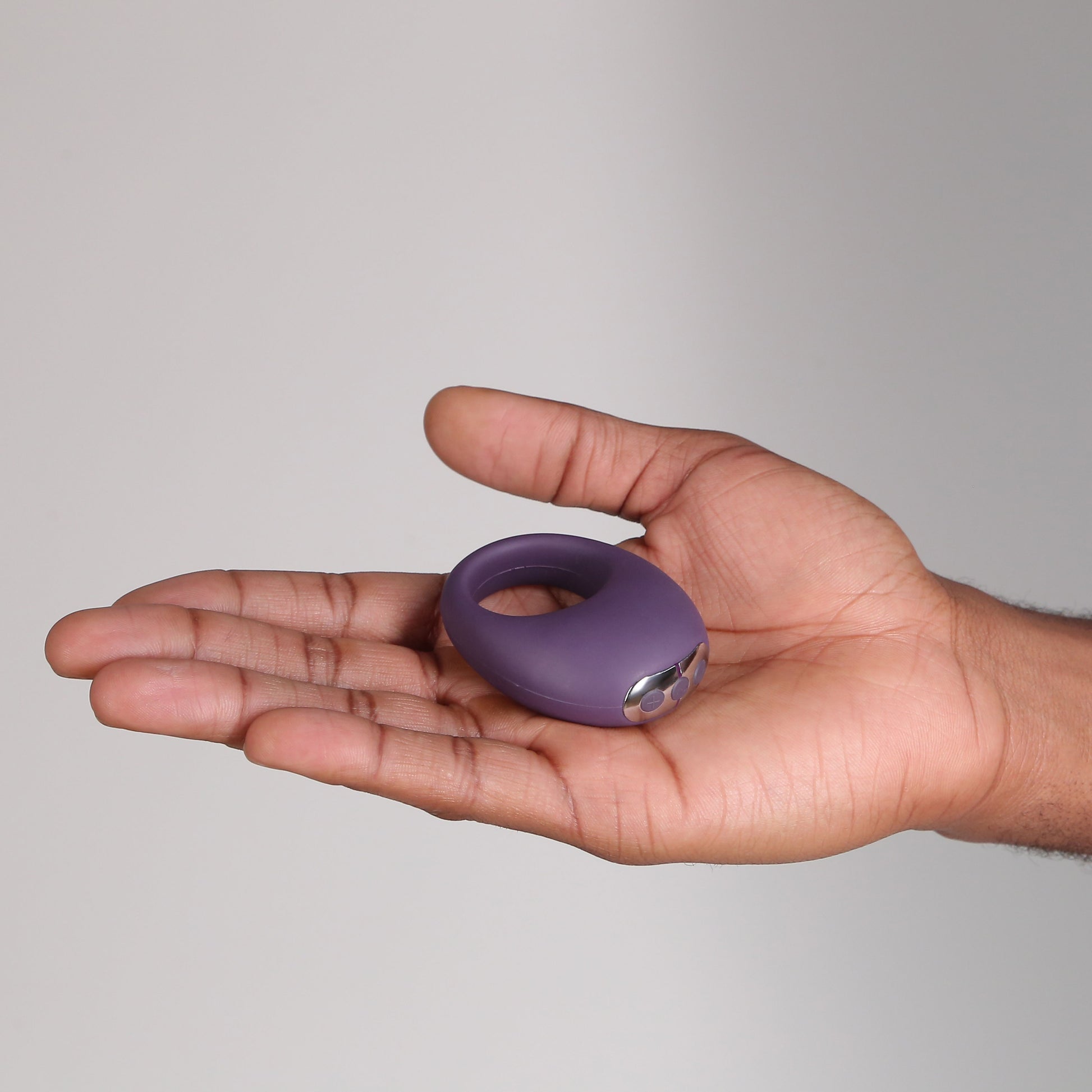 Hand holding Mio Vibrating Cock Ring