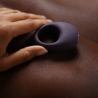 Mio Vibrating Cock Ring being held against skin