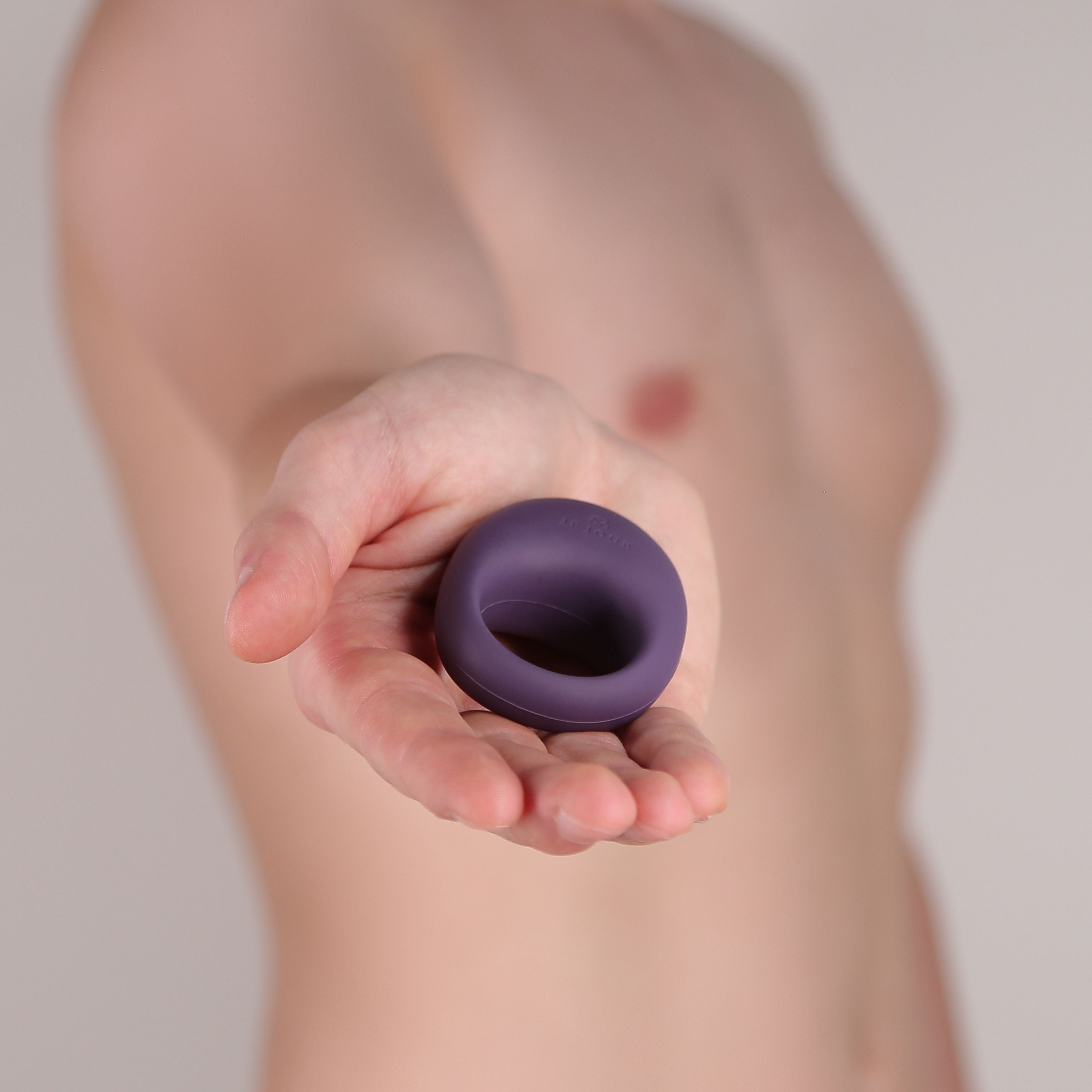 Man holding Mio Vibrating Cock Ring