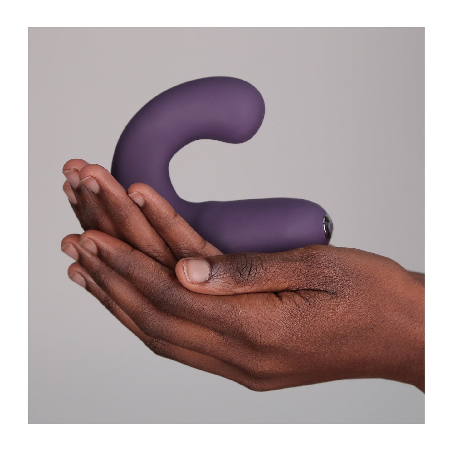 Hands holding G Kii Vibrator in purple 