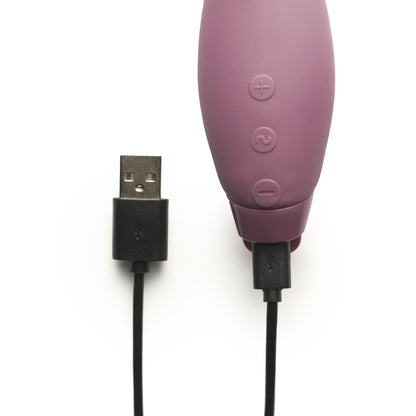 Purple Juno Vibrator with charger attached 