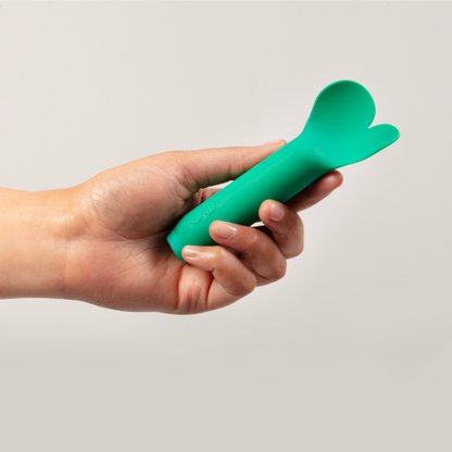 Emerald green Amour Vibrator in hand
